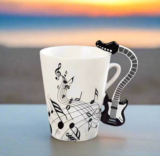 A music themed mug with black guitar handle