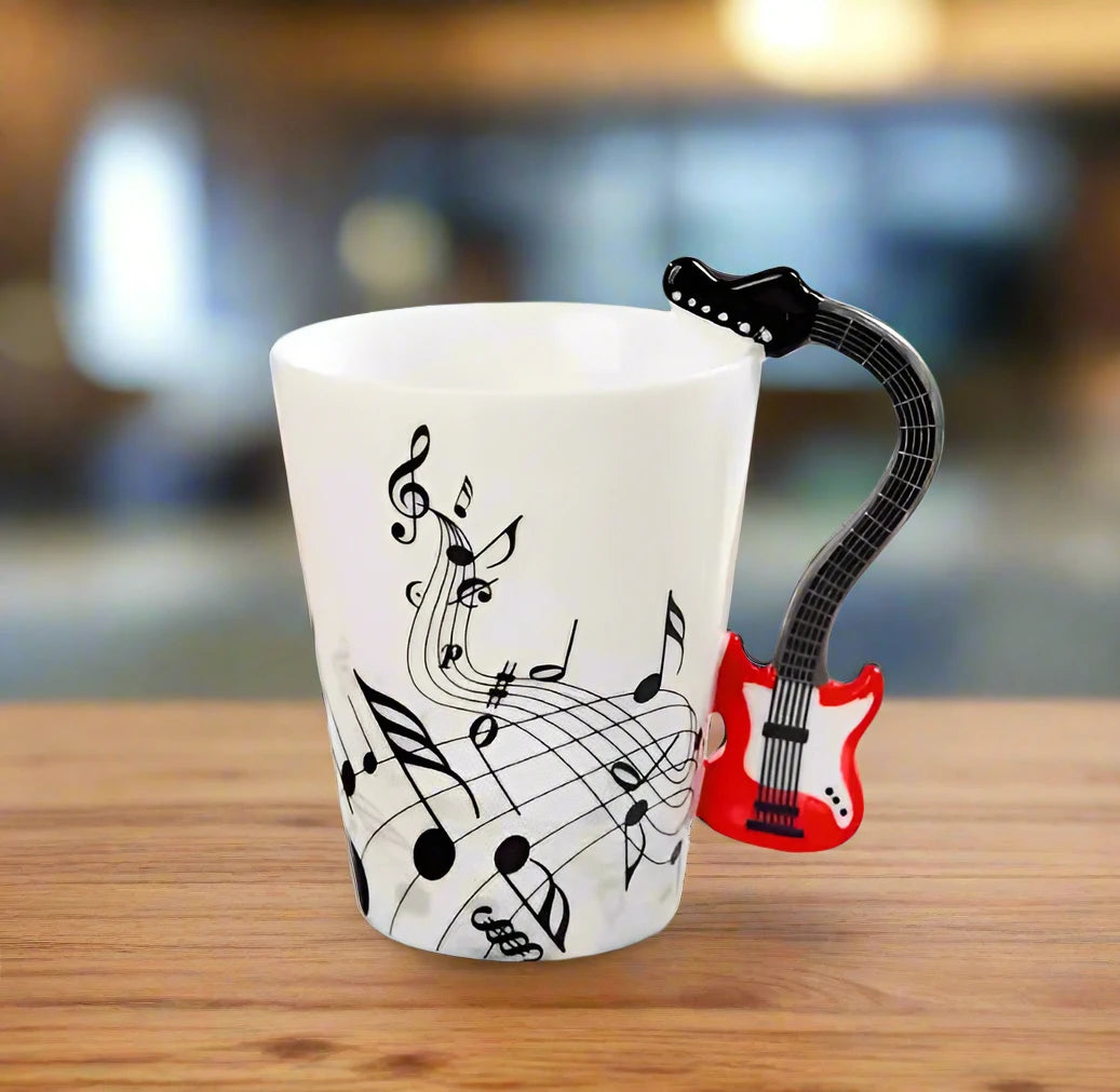Detailed view of elegant musical notes design on white ceramic coffee mug surface with guitar handle"